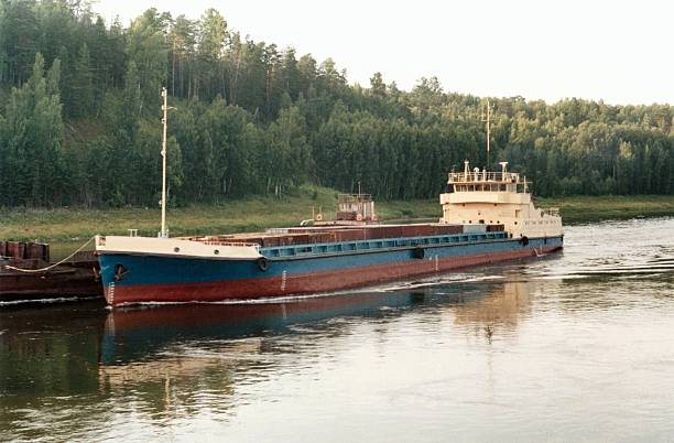 A large bulk cargo ship on the Mississippi River capable of shipping many different types of commodities internationally.