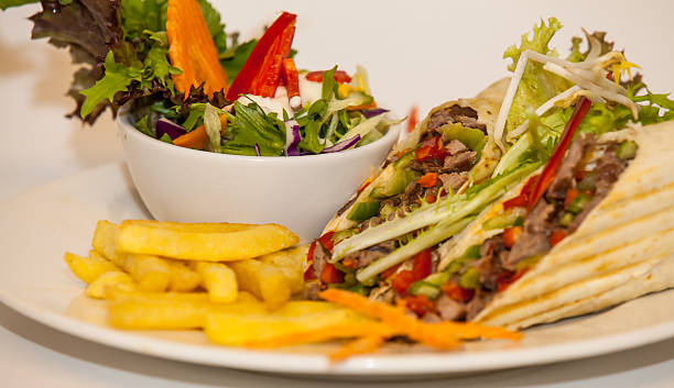 istock Roll with french fries and salad 523898237