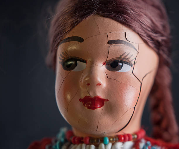 Doll head with cracked face stock photo