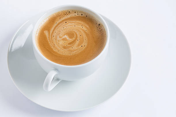 istock Cup of coffee on a white plate on white background 523899053