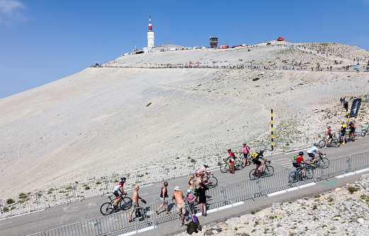Mont Ventoux, France- July 14 2013: Amateur cyclists climbing the road to Mount Ventoux before the apparition of the competitiors in the stage 15 of the 100 edition of Le Tour de France 2013.