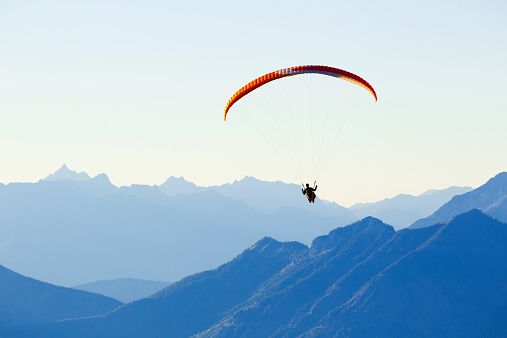 A man enjoys a paragliding adventure in British Columbia, Canada.