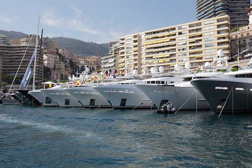 Monaco, Monaco - September 26th 2014: Many large yacht on display during the 2014 Monaco Yacht Show always draw wealthy prospective owners to inspect them.