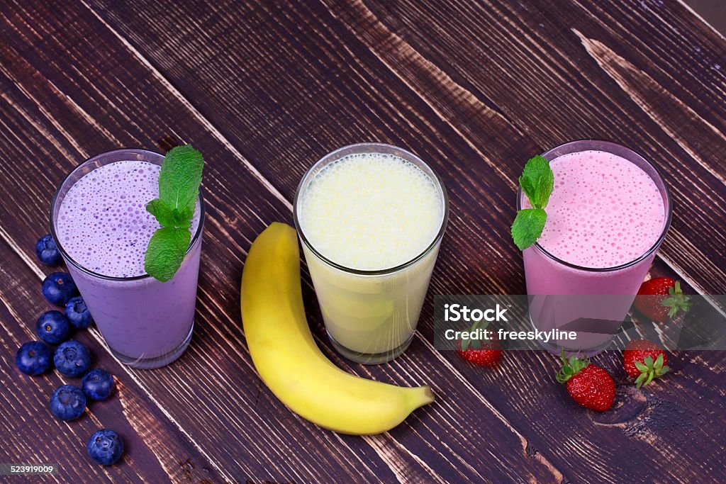 Strawberry, banana and blueberries milkshakes Blueberry Stock Photo