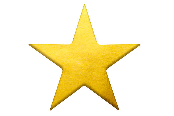 Close up of a gold star shape isolated on white background with clipping path.