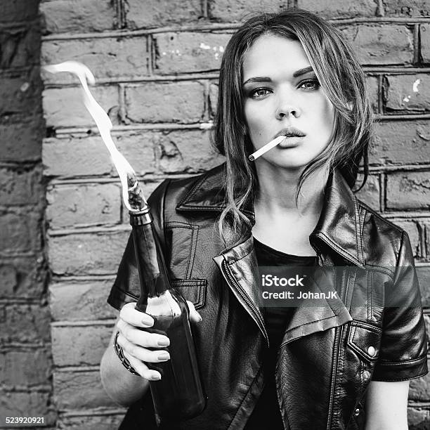 Portrait Of Beautiful Girl Smoking With Molotov Cocktail Stock Photo - Download Image Now