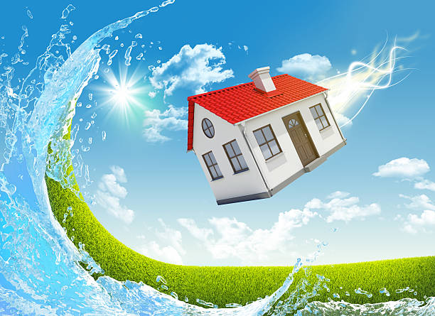 istock House is falling from the sky. Nature landscape with water 523921289