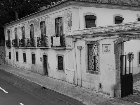 Lisbon, Portugal - August 14, 2012: Old two-storeyed dilapidated house on the street of Lisbon, Portugal in the day light