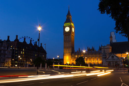 London, UK-  July 11, 2013: A view of Westminster at Night showing traffic on the road