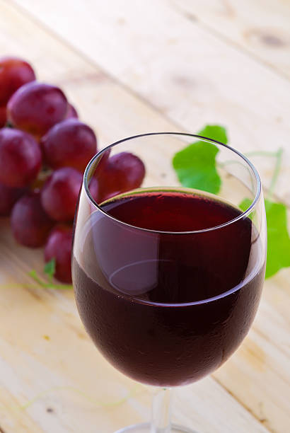 istock Glass filled with Red Grape Juice  and ripe sweet grape 523946207