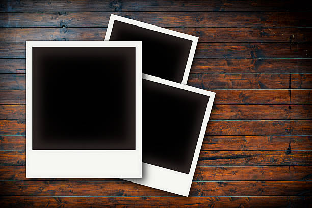 istock Photo frames on wooden board background texture 523967373