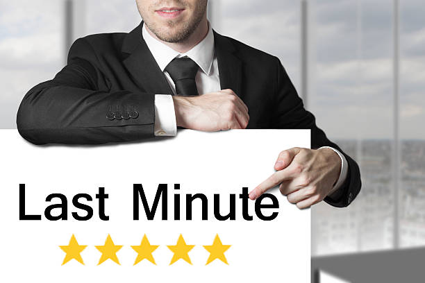 istock businessman pointing on sign last minute 523967579