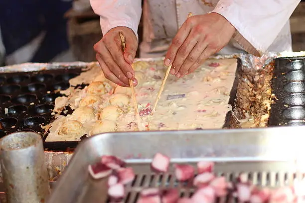 Oct 2014, Kyoto, Japan: Making Takoyaki in a stall of street