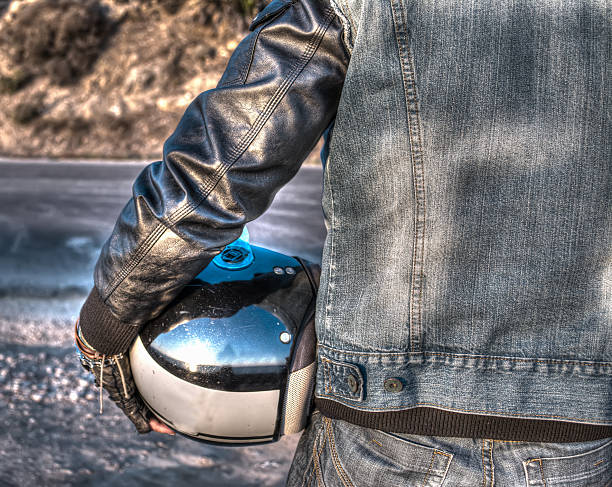 istock biker on the road at sunset in hdr 523995863