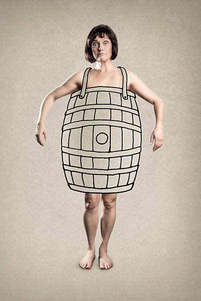 Poor Woman wearing a  Barrel - Conceptual - Funny Humor. Nice texture Wall Background.