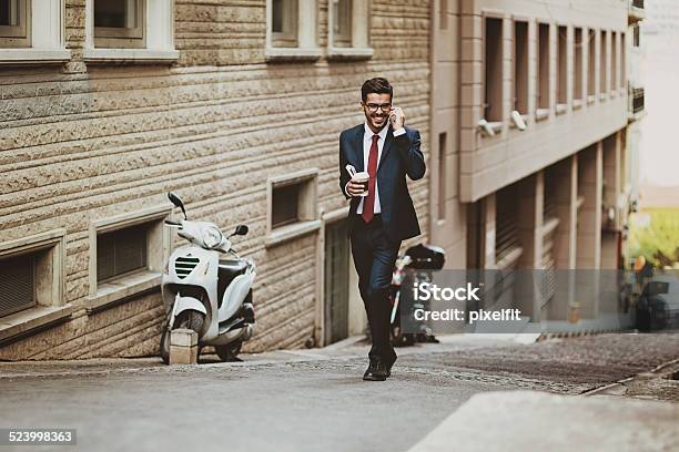Businessman Walking On The Street With Phone Stock Photo - Download Image Now - 25-29 Years, Adult, Adults Only