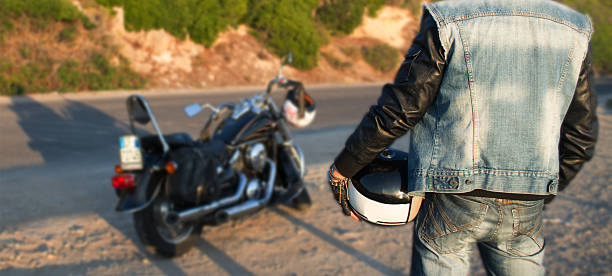 biker and motorcycle on the road stock photo