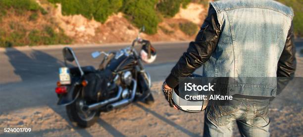 Biker And Motorcycle On The Road Stock Photo - Download Image Now - Waistcoat, Biker, Rear View