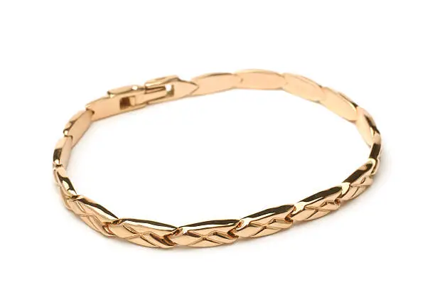Gold bracelet on white background