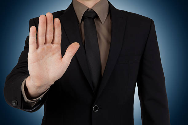 istock Businessman showing stop or stay gesture on blue background 524010982
