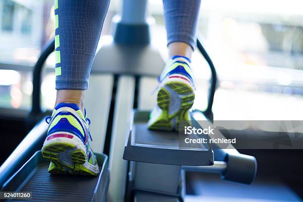 Woman Training On Ellipse Stock Photo - Download Image Now - Cross Trainer, Ellipse, Women