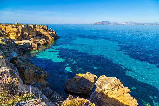 Coastline on Favignana island in Sicily, Italy, the Aegadian Coastline on Favignana island in Sicily, Italy, the Aegadian egadi islands photos stock pictures, royalty-free photos & images