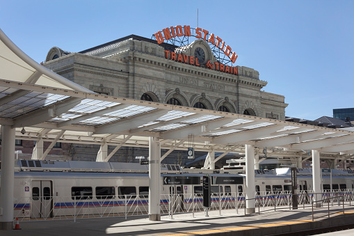 Denver, Colorado, USA - April 22, 2016: The first commuter rail train to Denver International Airport sits on the downtown tracks at the Grand Opening of the RTD University of Colorado A Line from Denver's Union Station.