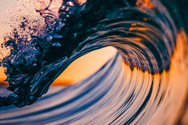 Breaking Wave A close up with detail of a wave breaking breaking wave stock pictures, royalty-free photos & images