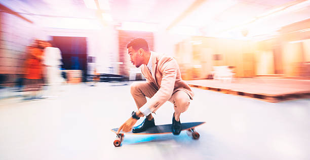 istock Young businessman skateboarding in offices 524016274