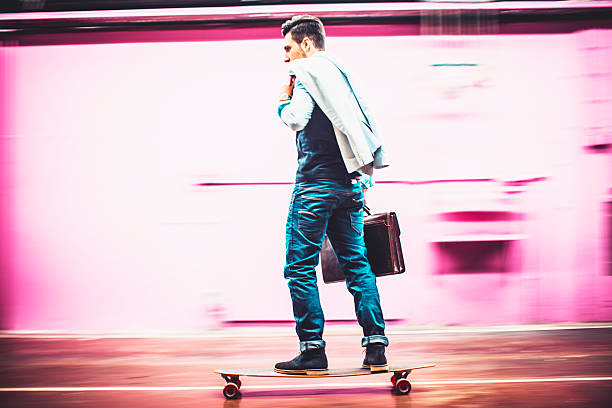 istock Young businessman skateboarding in offices 524017550