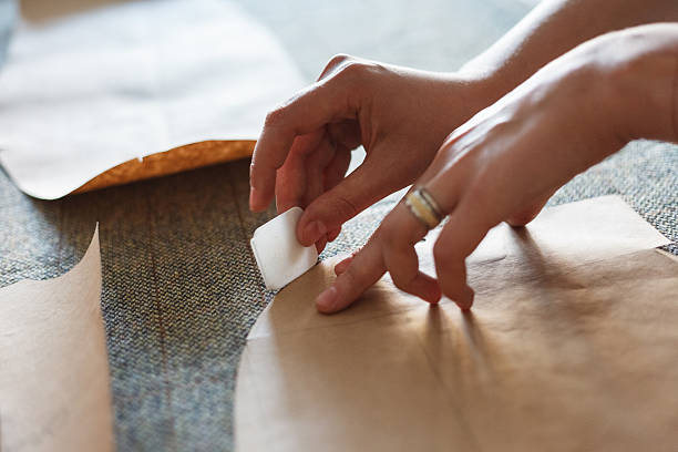 istock The woman draws with soap markup patterns on tweed fabric 524017716