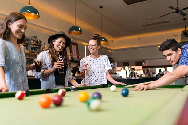 istock Friends Enjoying Pool Game in a Bar 524020918