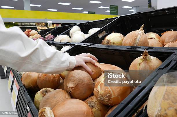 Woman Picking Fresh Onion Inside Walmart Store Stock Photo - Download Image Now - Store, Retail, Food