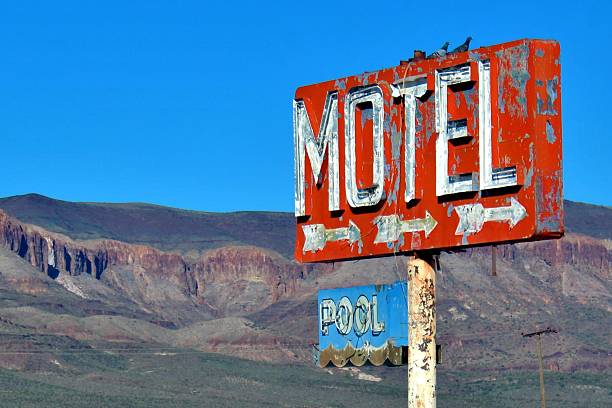 istock Pigeons Roosting Atop Motel Sign 524022284