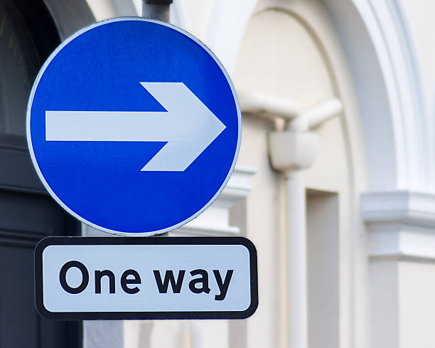 one way right A British directional road sign,one way right one way stock pictures, royalty-free photos & images