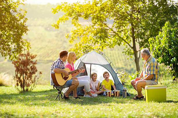 istock happy parent and children enjoying camping 524022986