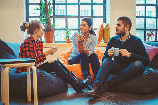 istock young people relaxing and chatting 524024602