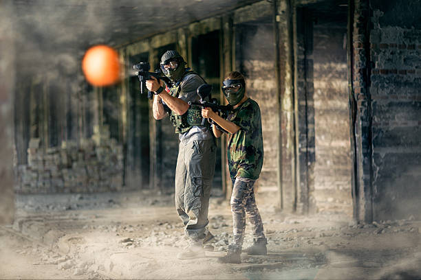 istock paintball team together in action 524024756