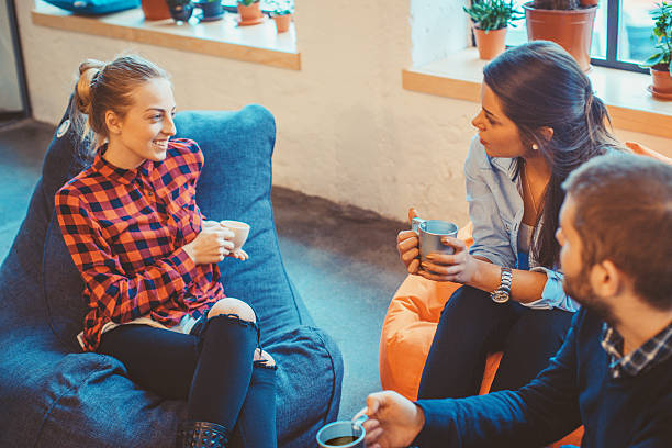 istock young people relaxing and chatting 524024860