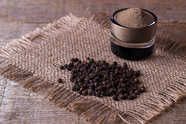 istock black pepper corns and powder 524025438