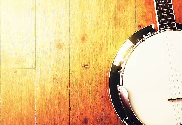 istock Cropped five-string bluegrass banjo on wood 524025692