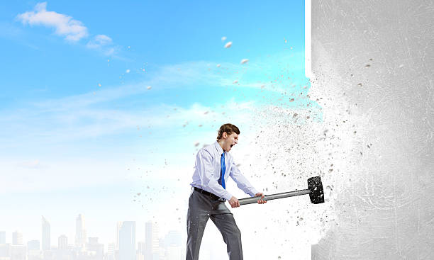 istock Businessman with hammer 524025929