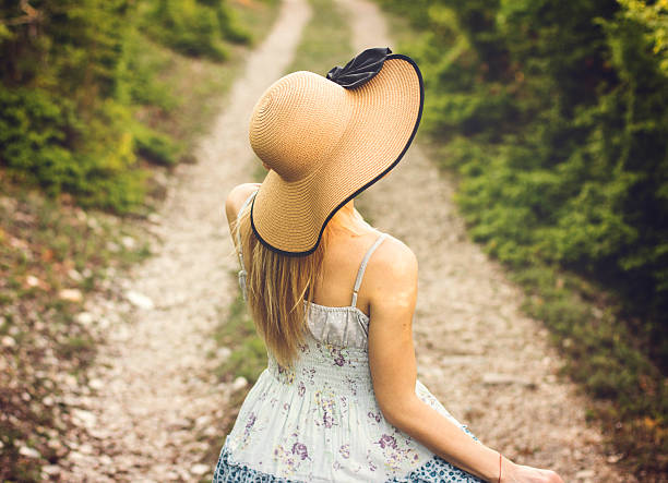 istock Girl on dirt road taking walk 524026420