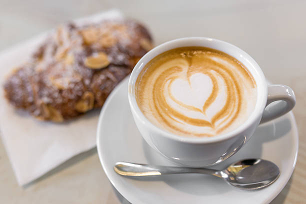 istock Italian cappuccino with fresh almond cornetti 524026886