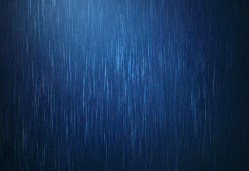 the rain water drop falling in rainy season with dark blue color as absract  background