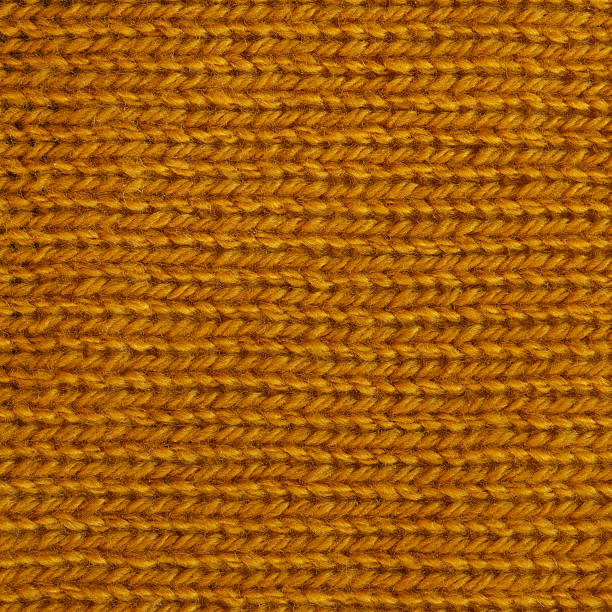 istock Dark goldenrod wool knitted fabric texture. 524028360