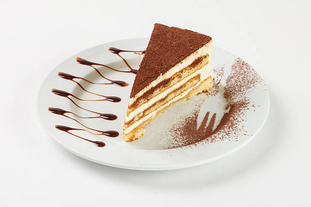 istock Delicious chocolate cream cake on the plate on white background. 524028912