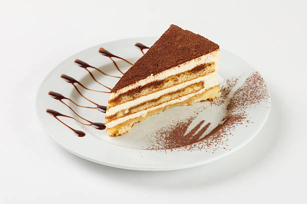 istock Delicious chocolate cream cake on the plate on white background. 524028962