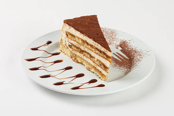 istock Delicious chocolate cream cake on the plate on white background. 524029026
