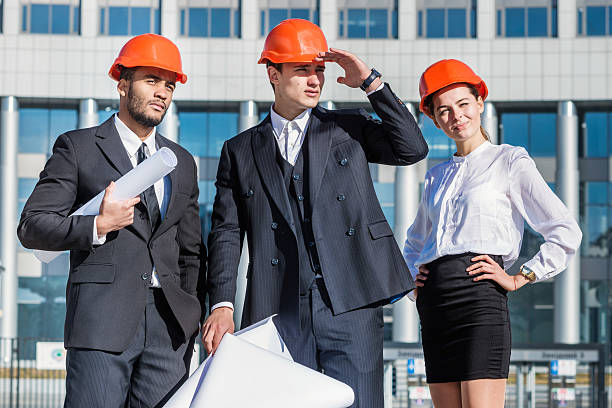 istock New project. A group of three architects are looking forward 524029127